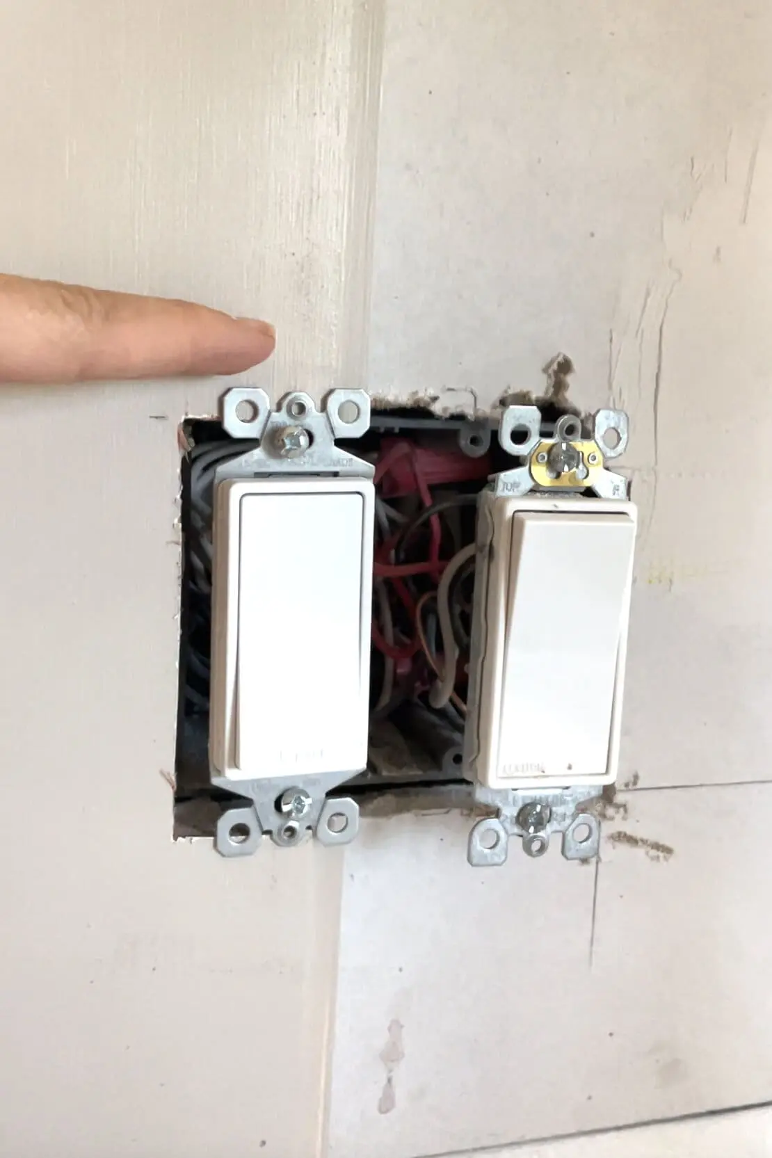 Installing a DIY shiplap backsplash.